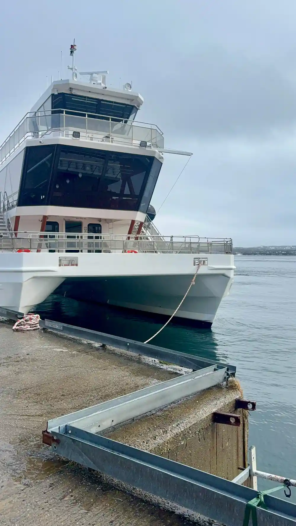 Large ferry boat moored at dock during daytime